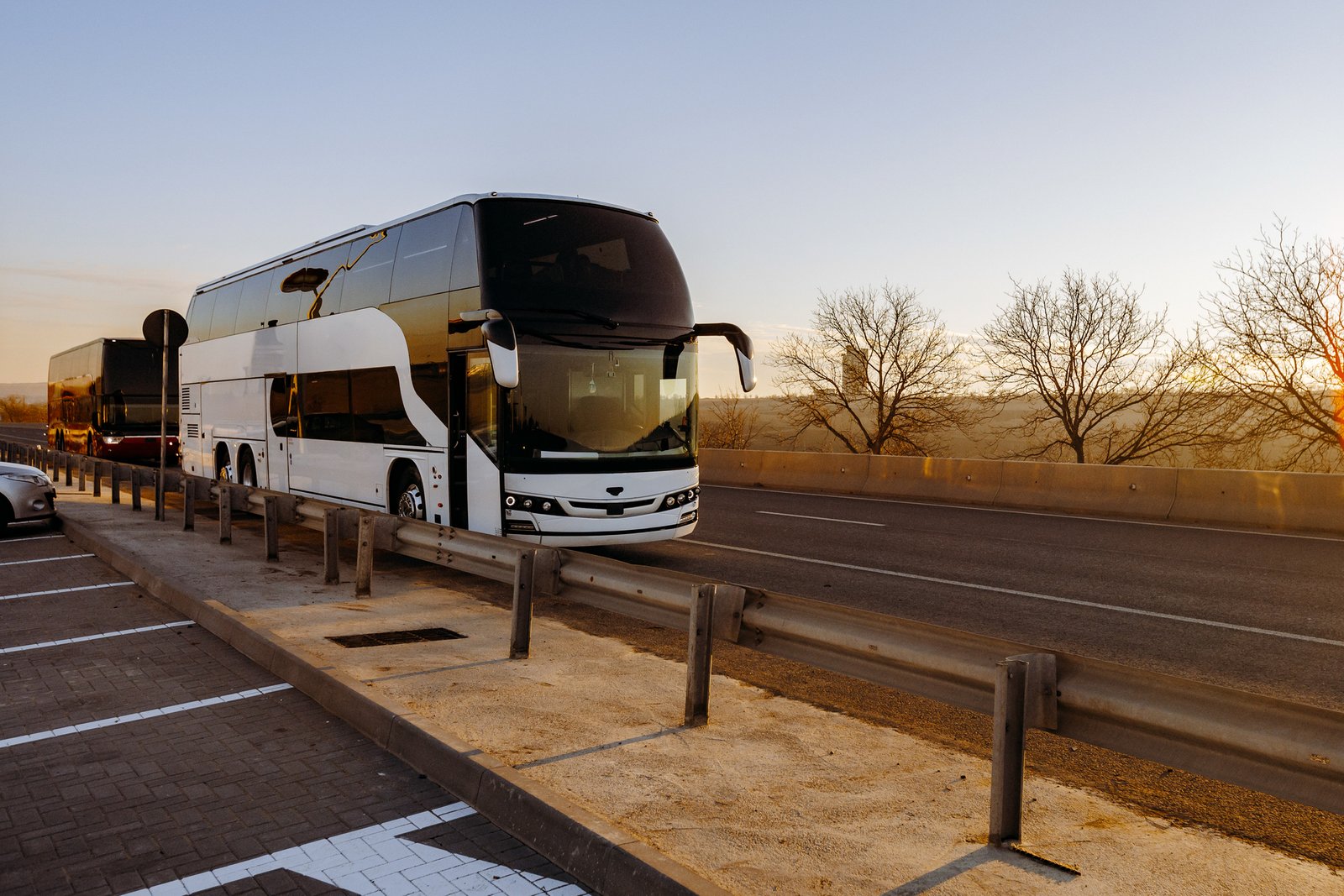 StarTrans luxury coach bus parked at a scenic Ontario destination during a multi-day group road trip