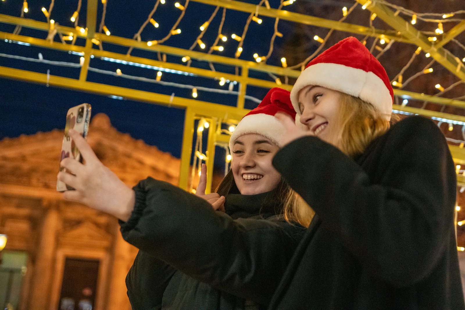 Group enjoying Toronto Christmas lights from a charter bus during the holiday season